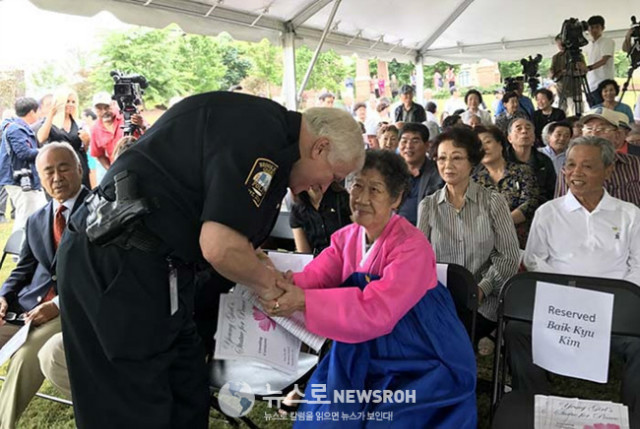 Gary Yandura, Bookhaven Chief of Police greets Grandma Kang.jpg